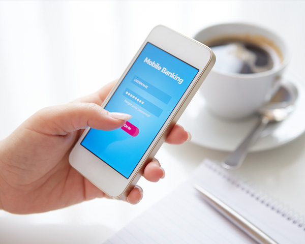 woman using her cellphone to do mobile banking